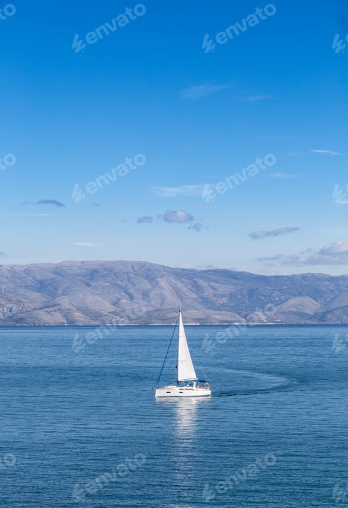 Preview: Sailing boat on blue sea waters with clear blue sky