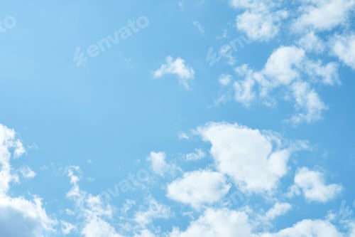 Preview: Sky. Blue sky with white clouds background. Curly clouds on a sunny summer day. Light cloudy. Good w
