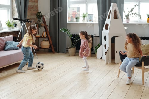 Preview: Young Girls Play with Ball in Bright Room