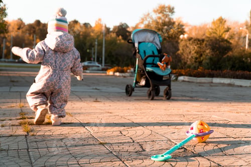 Preview: Child walking in city park