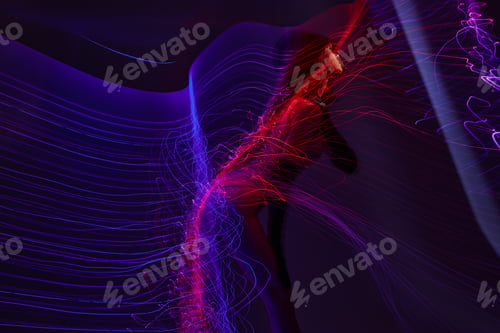 Preview: Positive young woman neon lines posing model glamor color background unaltered