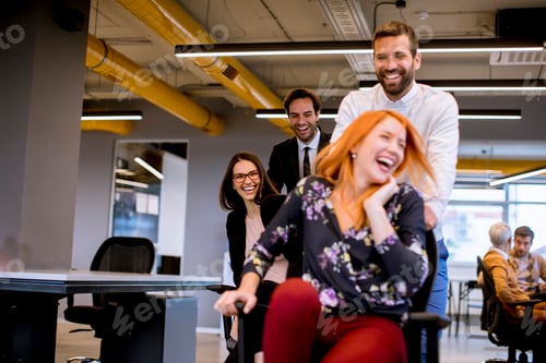 Preview: Young cheerful business people in smart casual wear having fun