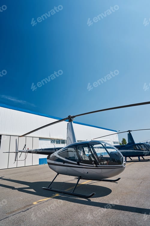 Preview: Private choppers parked on helipad in morning