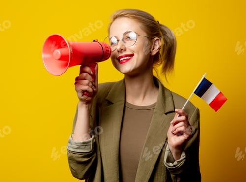 Preview: Style blonde woman in jacket with French flag and megaphone on yellow background