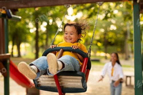 Preview: Korean Baby Girl Swinging Having Fun With Mommy On Playground