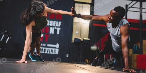 Preview: Personal trainer coach helping woman exercising in sport gym, exercise training workout in fitness