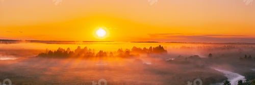 Preview: Amazing Sunrise Over Misty Landscape. Scenic View Of Foggy Morning Sky With Rising Sun Above Misty