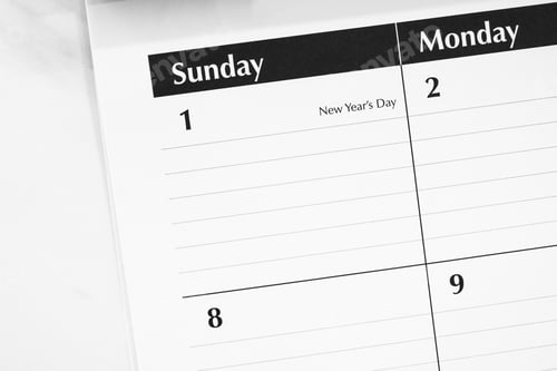Preview: Overhead view of New Years Day on a desktop calendar
