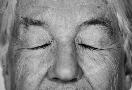 Preview: Black and white portrait of a white elderly woman eyes closed