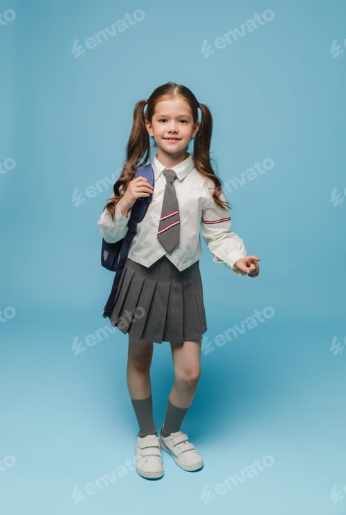 Preview: Smiling Girl Posing with School Uniform and Backpack