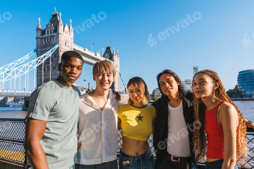 Preview: Multiracial group of happy young friends bonding in London