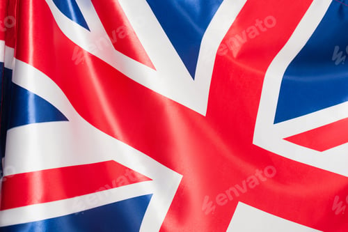Preview: close up of national flag of united kingdom with red cross