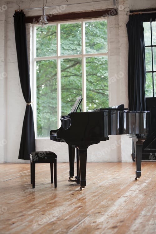 Preview: Grand Piano and Piano Stool in a rehearsal studio.