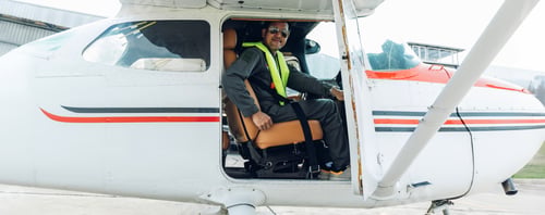 Preview: Pilot in uniform at airport. Asian Confident male pilot in uniform and checking flight plan