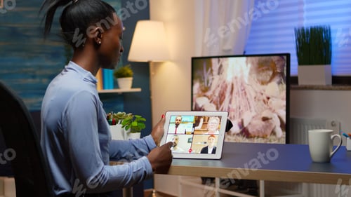 Preview: African business woman having webinar studying from home