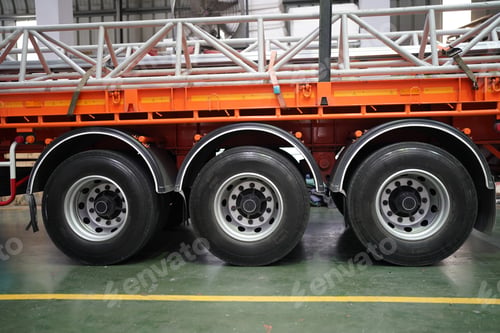 Preview: side view on truck with big wheel and loading steel pole on truck.