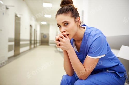 Preview: Close up of upset female nurse in the corridor
