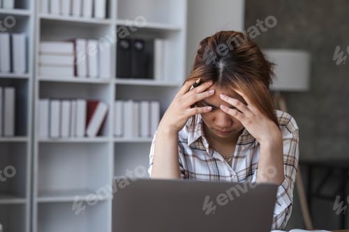 Preview: Portrait of frustrated worried young Asian girl looks at laptop upset by bad news, negative bullying
