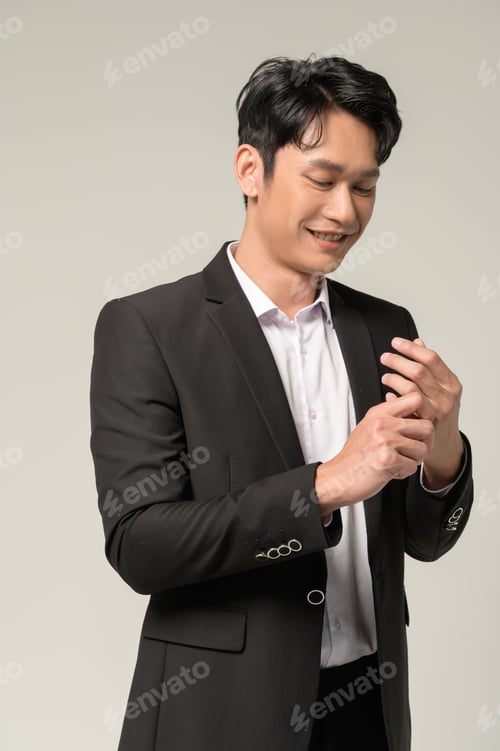 Preview: Portrait of Happy asian man wearing suit over white background