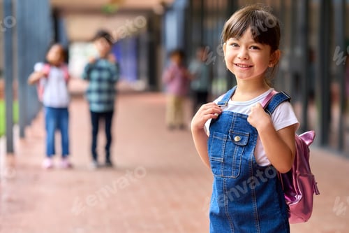 Preview: Portrait Of Smiling Female Elementary School Pupil Outdoors With Backpack At School