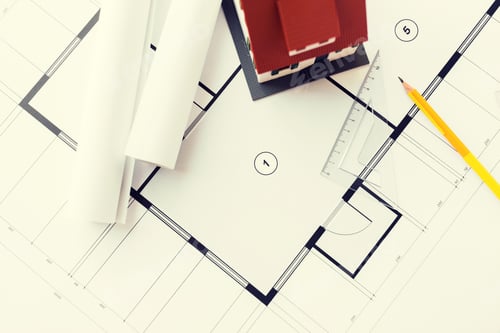 Preview: close up of house model on architectural blueprint