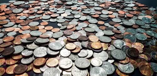 Preview: Denominations of various coins in collection of pocket change in business and finance.