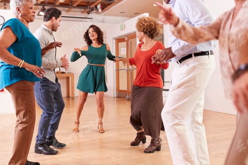 Preview: People Attending Dance Class In Community Center