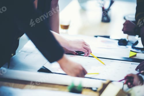 Preview: Group of business people hands working on wood desk in office top view.