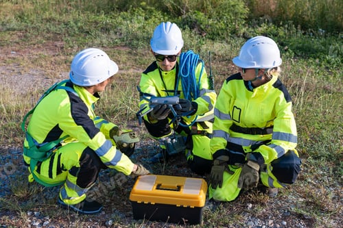 Preview: Engineers preparing drone for wind farm inspection
