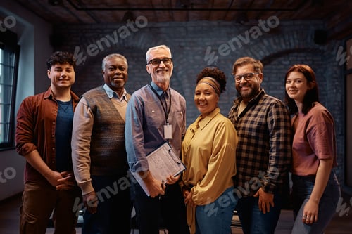 Preview: Group therapy participants and their counselor at mental health center looking at camera.