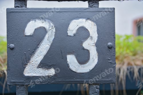 Preview: Closeup shot of the number twenty three sign on a gray background
