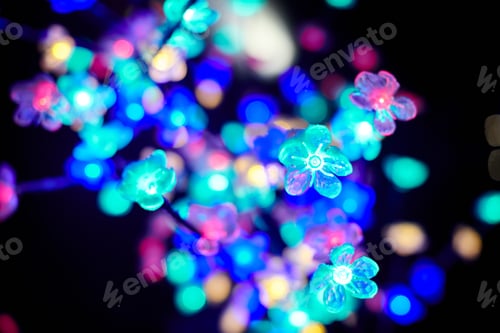 Preview: Colorful lights bokeh from decorative luminous flowers garlands at holiday, multicolored lights