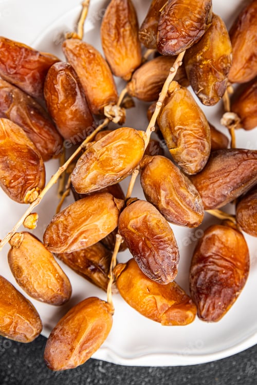 Preview: date on a branch dried sweet fruit fresh appetizer meal food snack on the table copy space food