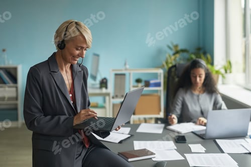 Preview: Caucasian Middle Aged Woman Using Laptop during Business Video Conference Call