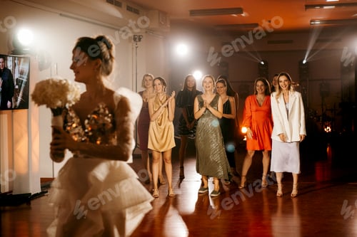 Preview: bride in a white dress throws a wedding bouquet