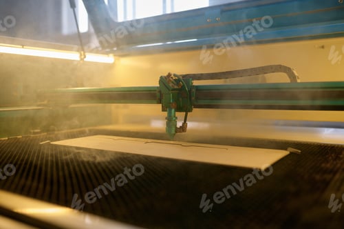 Preview: An automated CNC laser machine operating with wooden plank