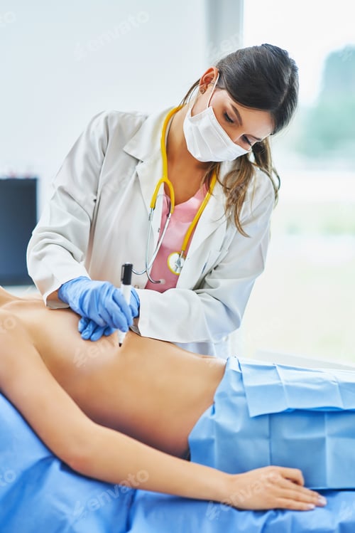 Preview: Plastic surgeon consulting a female patient