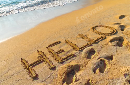 Preview: Word “hello” written in the golden sand