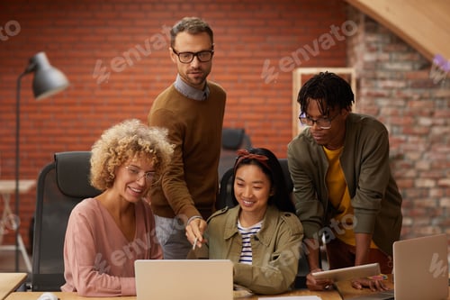 Preview: Business team using laptop at work