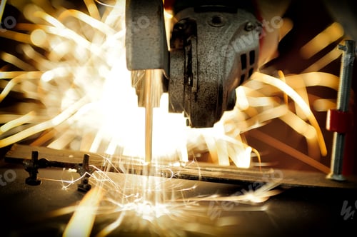 Preview: Worker cutting metal with grinder