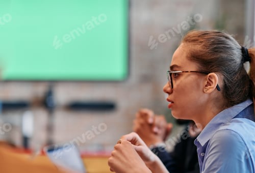 Preview: Businesswoman Leading Discussion in Modern Office Setting