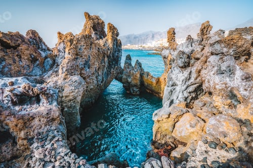 Preview: Natural swimming pool. Charco el Diablo, bizarre lava volcanic rock cliffs near to town Puerto de
