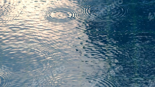Preview: Rain drops on the swimming pool.