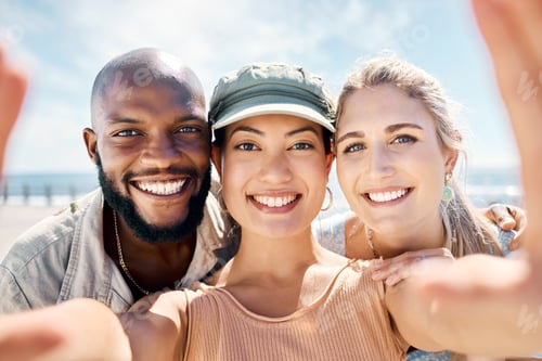 Preview: Shot of a diverse group of friends standing outside together and taking selfies