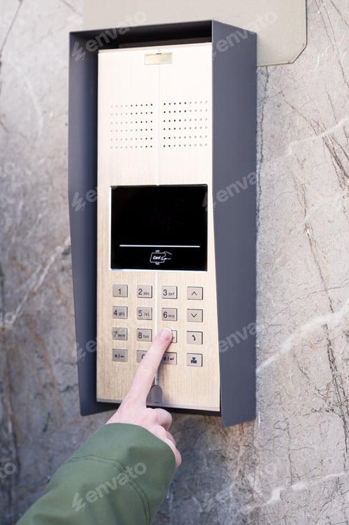 Preview: Person entering security code on keypad access control system.