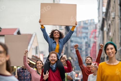 Preview: Happy group of people holding blank banner during strike