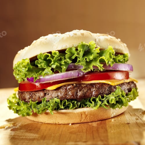 Preview: cheeseburger with lettuce tomato and onion.