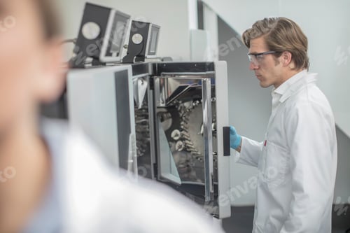 Preview: Scientist inspecting equipment in a laboratory