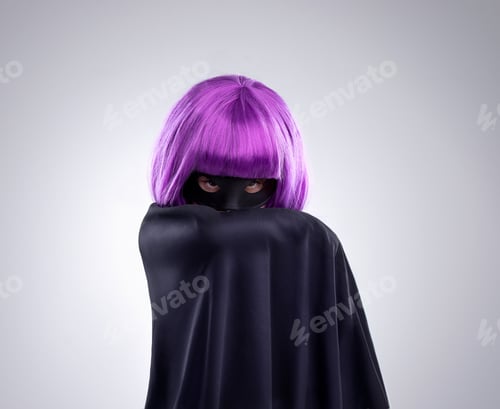 Preview: Her identity is a mysery. A studio shot of a confident little girl playing dress-up.