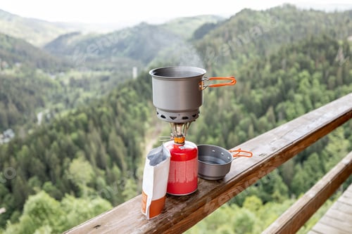 Preview: Preparing food for hiking in mountains